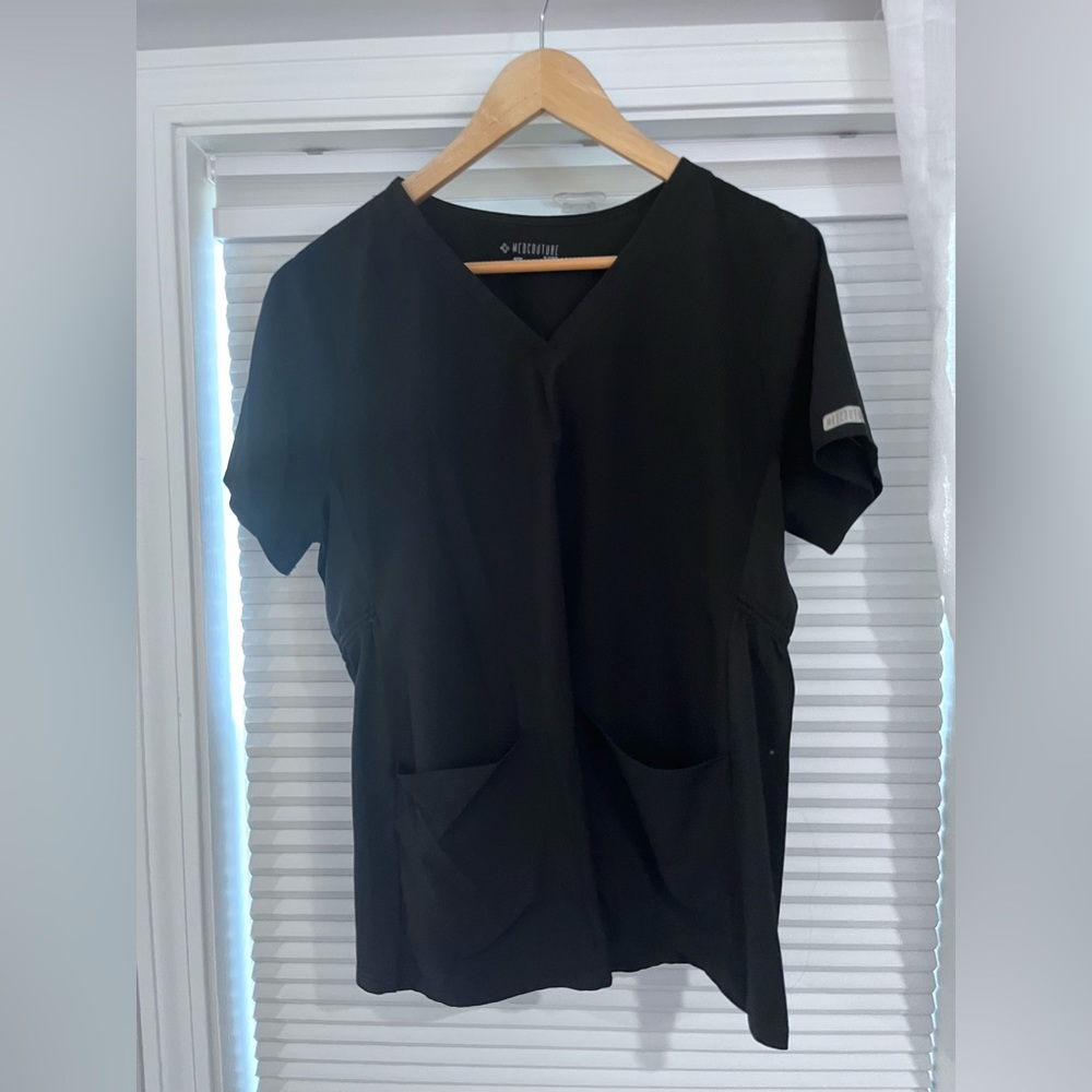 Maternity Med Couture scrub top with adjustable elastic bungee for extended fit.